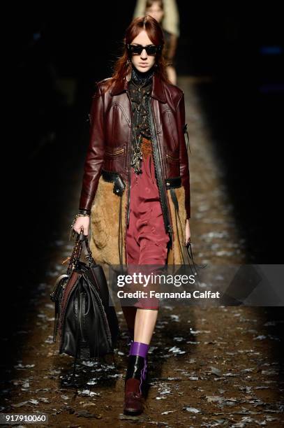 Model walks the runway for Coach 1941 during New York Fashion Week at Basketball City on February 13, 2018 in New York City.