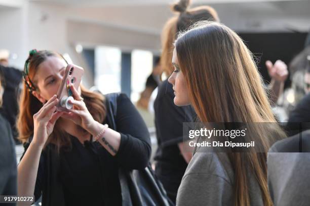 Model prepares backstage for Naeem Khan during New York Fashion Week: The Shows at Gallery I at Spring Studios on February 13, 2018 in New York City.