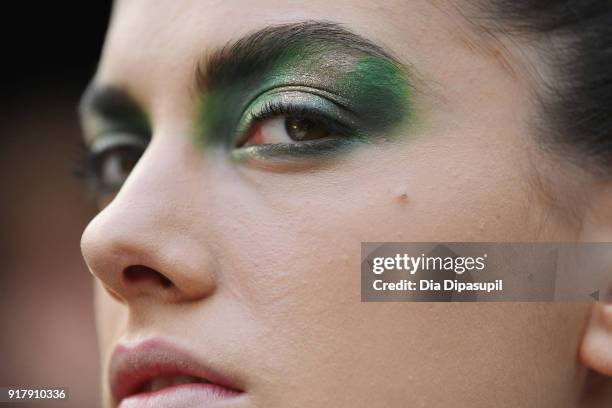 Model prepares backstage for Naeem Khan during New York Fashion Week: The Shows at Gallery I at Spring Studios on February 13, 2018 in New York City.