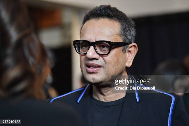 Designer Naeem Khan gives an interview backstage for Naeem Khan during New York Fashion Week: The Shows at Gallery I at Spring Studios on February...