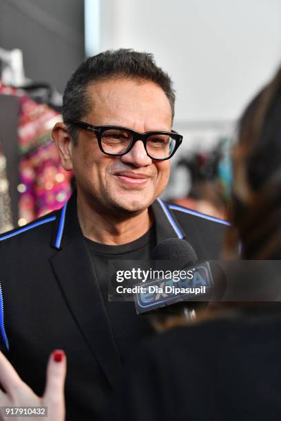 Designer Naeem Khan gives an interview backstage for Naeem Khan during New York Fashion Week: The Shows at Gallery I at Spring Studios on February...