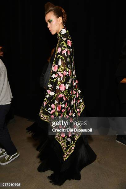 Model prepares backstage for Naeem Khan during New York Fashion Week: The Shows at Gallery I at Spring Studios on February 13, 2018 in New York City.