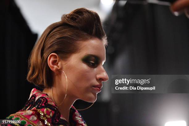 Model prepares backstage for Naeem Khan during New York Fashion Week: The Shows at Gallery I at Spring Studios on February 13, 2018 in New York City.