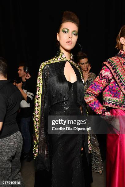 Model prepares backstage for Naeem Khan during New York Fashion Week: The Shows at Gallery I at Spring Studios on February 13, 2018 in New York City.