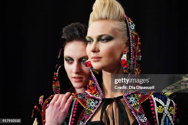 Models pose backstage for Naeem Khan during New York Fashion Week: The Shows at Gallery I at Spring Studios on February 13, 2018 in New York City.