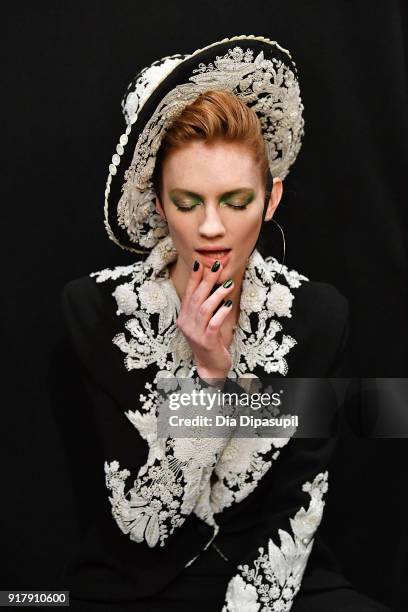 Model poses backstage for Naeem Khan during New York Fashion Week: The Shows at Gallery I at Spring Studios on February 13, 2018 in New York City.