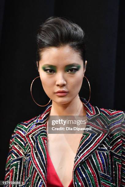 Model poses backstage for Naeem Khan during New York Fashion Week: The Shows at Gallery I at Spring Studios on February 13, 2018 in New York City.