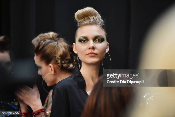 Model poses backstage for Naeem Khan during New York Fashion Week: The Shows at Gallery I at Spring Studios on February 13, 2018 in New York City.