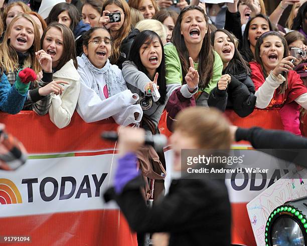 Fans watch Justin Bieber perform on NBC's "Today" at Rockefeller Center on October 12, 2009 in New York City.