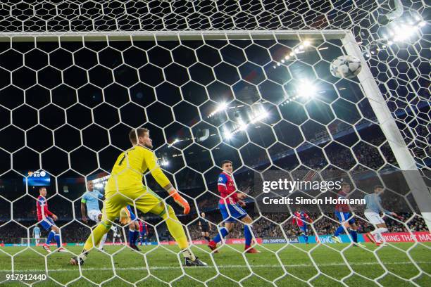 Ilkay Gundogan of Manchester City scores his team's first goal past goalkeeper Tomas Vaclik of Basel during the UEFA Champions League Round of 16...