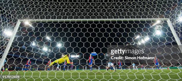 Bernardo Silva of Manchester City scores his team's second goal past goalkeeper Tomas Vaclik of Basel during the UEFA Champions League Round of 16...