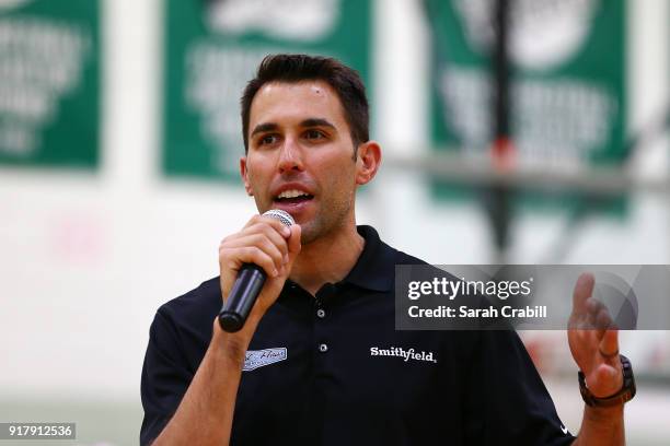 Aric Almirola, driver of the Smithfield Ford Fusion for Stewart-Haas Racing in the Monster Energy NASCAR Cup Series, speaks to honor-roll students at...