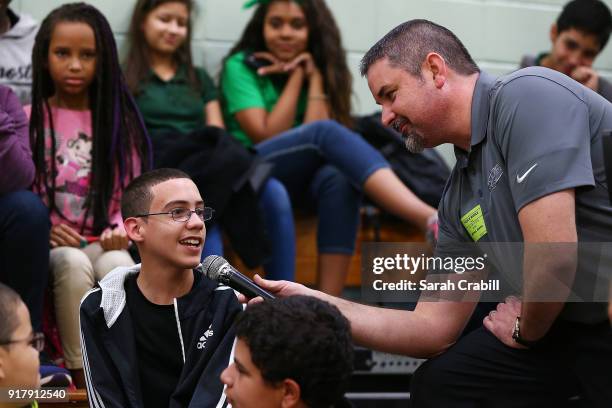 Students participate in a question and answer with Aric Almirola, driver of the Smithfield Ford Fusion for Stewart-Haas Racing in the Monster Energy...