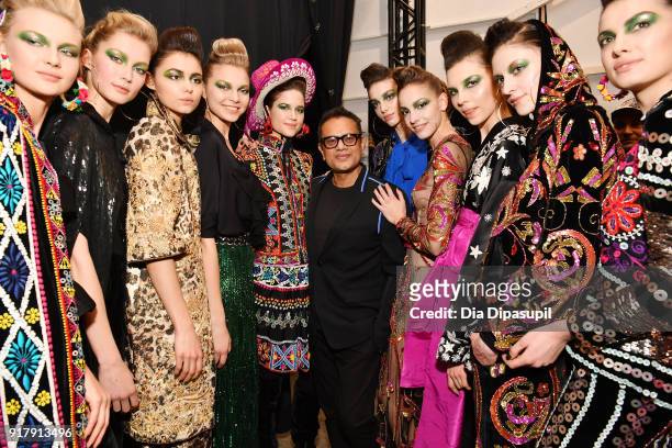 Designer Naeem Khan and models pose backstage for Naeem Khan during New York Fashion Week: The Shows at Gallery I at Spring Studios on February 13,...