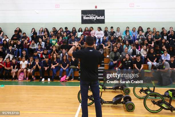 Aric Almirola, driver of the Smithfield Ford Fusion for Stewart-Haas Racing in the Monster Energy NASCAR Cup Series, visits honor-roll students at...