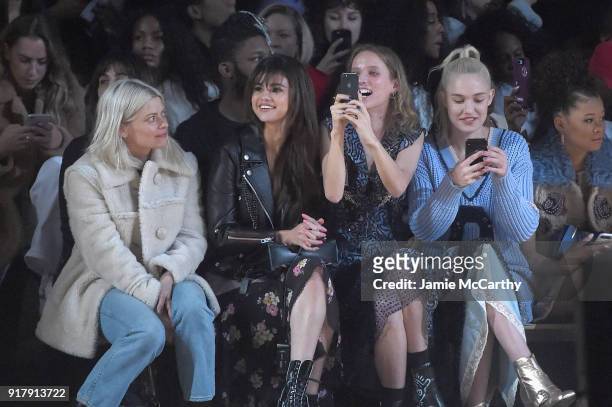 Selena Gomez, Petra Collins, and Carlotta Kohl attend the Coach 1941 front row during New York Fashion Week at Basketball City on February 13, 2018...