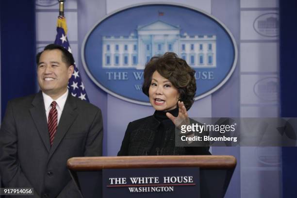 Elaine Chao, U.S. Transportation secretary, right, speaks while Derek Kan, U.S. Transportation undersecretary, listens during a White House press...