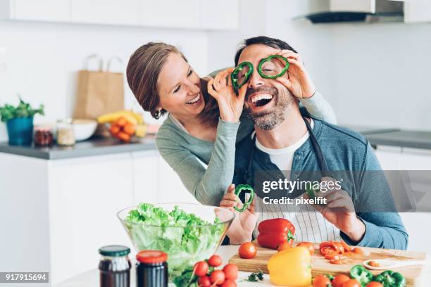 happy middle aged couple - woman laugh cook stock pictures, royalty-free photos & images