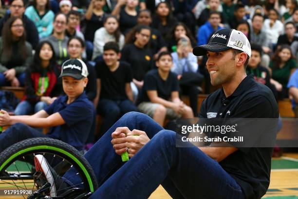 Aric Almirola, driver of the Smithfield Ford Fusion for Stewart-Haas Racing in the Monster Energy NASCAR Cup Series, participates in a tricycle race...