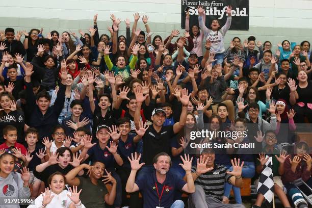 Aric Almirola, driver of the Smithfield Ford Fusion for Stewart-Haas Racing in the Monster Energy NASCAR Cup Series, and honor-roll students pose for...