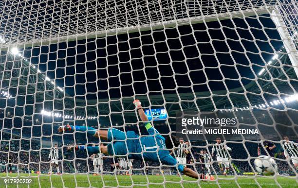 Juventus' goalkeeper from Italy Gianluigi Buffon fails to stop a goal during the UEFA Champions League round of sixteen first leg football match...