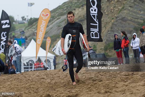 Event wildcard Dean Bowen of Australia walks back to the competitors area after loosing his Round 1 heat of the Billabong Pro on October 12, 2009 at...