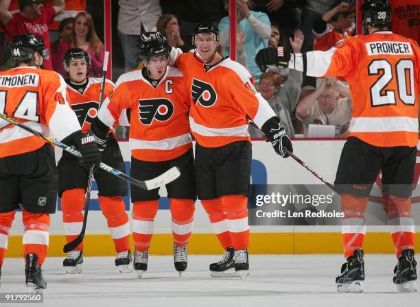 Kimmo Timonen, Danny Briere, Mike Richards, Jeff Carter and Chris Pronger of the Philadelphia Flyers all celebrate a second period goal against the...