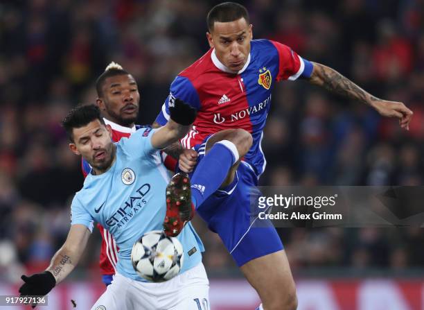 Sergio Aguero of Manchester is challenged by Leo Lacroix of Basel during the UEFA Champions League Round of 16 First Leg match between FC Basel and...