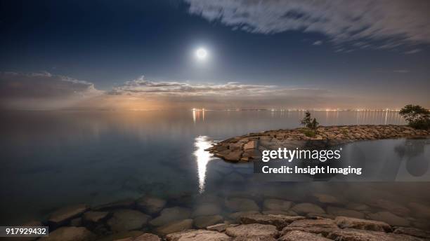 stillness during the full moon - burlington fotografías e imágenes de stock