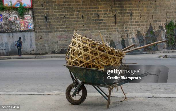 wheelbarrow in antananarivo on the african island of madagascar - african woven baskets stock pictures, royalty-free photos & images