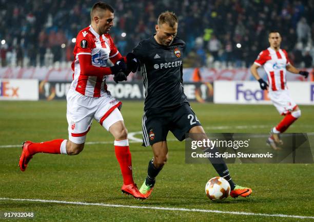 Vasili Berezutski of CSKA Moscow in action against Nenad Krsticic of Crvena Zvezda during the UEFA Europa League Round of 32 match between Crvena...