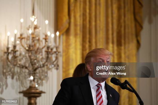 President Donald Trump speaks during a reception in the East Room of the White House February 13, 2018 in Washington, DC. President Trump and first...