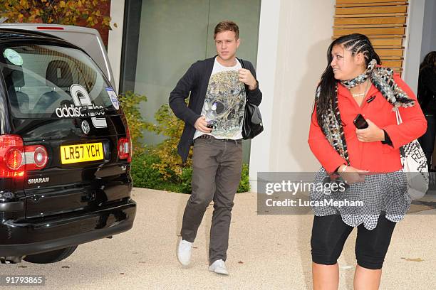 Olly Murs and Graziella Affinita of Miss Frank arrive back at the X Factor house on October 12, 2009 in London, England.