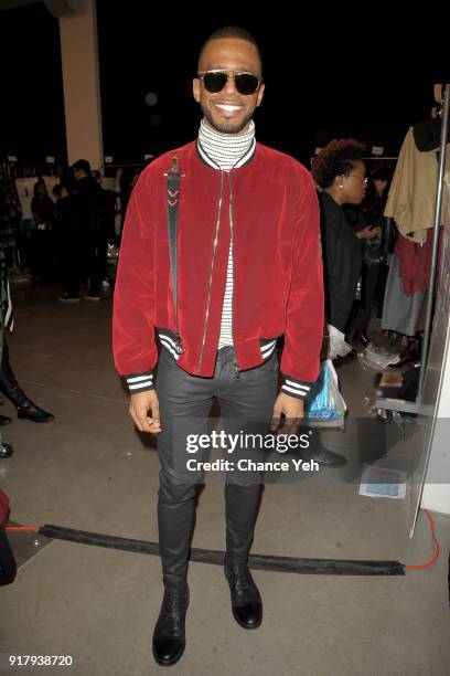 Actor Eric West poses backstage for Vivienne Tam during New York Fashion Week at Spring Studios on February 13, 2018 in New York City.