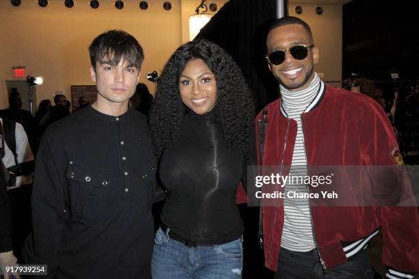 Samuel Mancini, Tashiana Washington, and Eric West pose backstage for Vivienne Tam during New York Fashion Week at Spring Studios on February 13,...