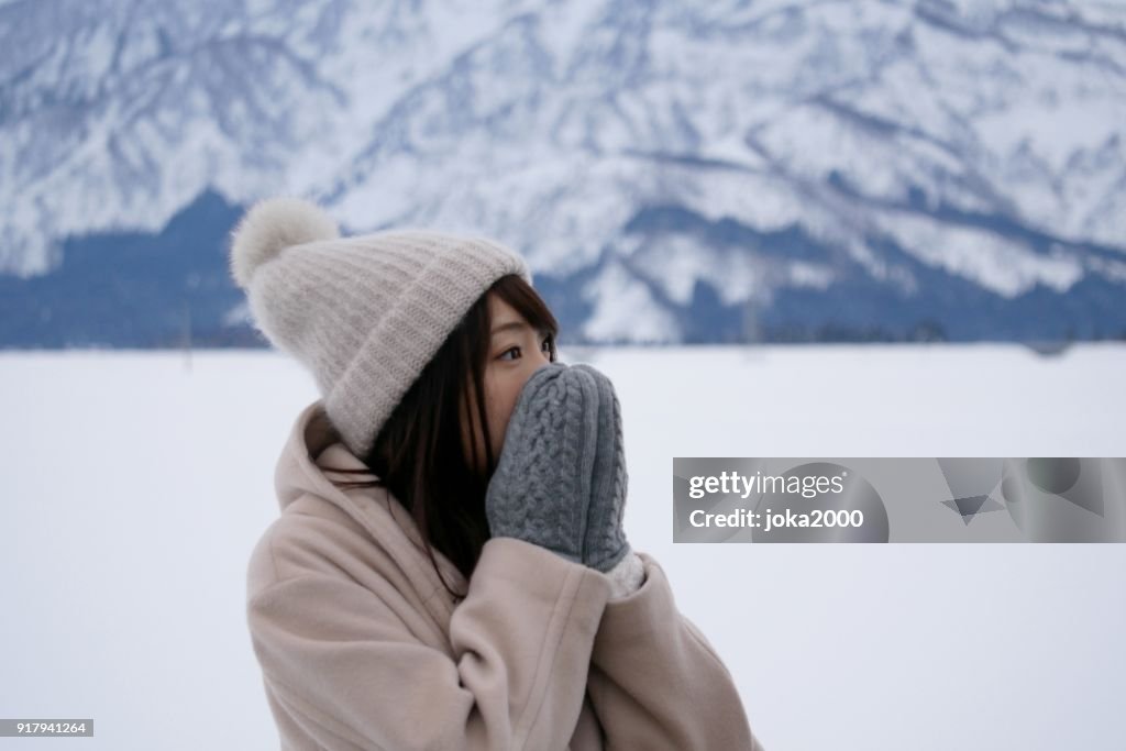 Young Woman holding face with hands