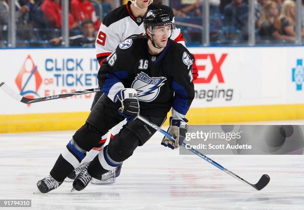 Drew Miller of the Tampa Bay Lightning skates to the play against the New Jersey Devils at the St. Pete Times Forum on October 8, 2009 in Tampa,...