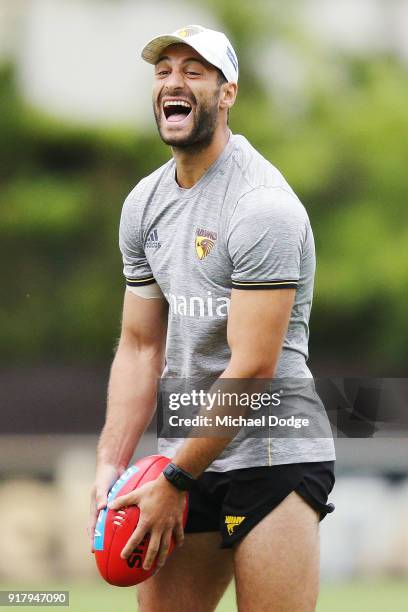 David Mirra, finally drafted to the senior team after years at VFL level, reacts during a Hawthorn Hawks AFL training session on February 14, 2018 in...