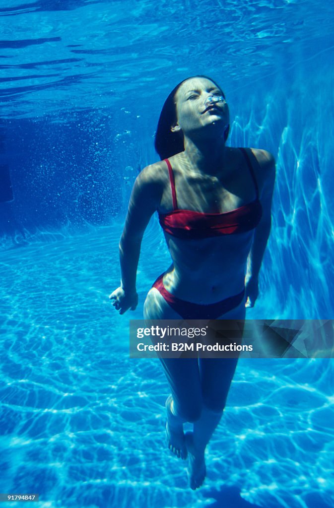 Woman swimming underwater