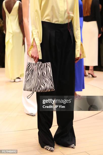 Models pose during BOSS Womenswear Gallery Collection During New York Fashion Week Mens' at Cedar Lake on February 13, 2018 in New York City.