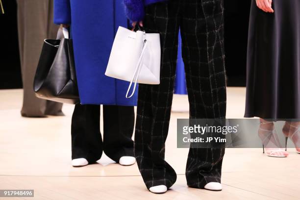 Models pose during BOSS Womenswear Gallery Collection During New York Fashion Week Mens' at Cedar Lake on February 13, 2018 in New York City.