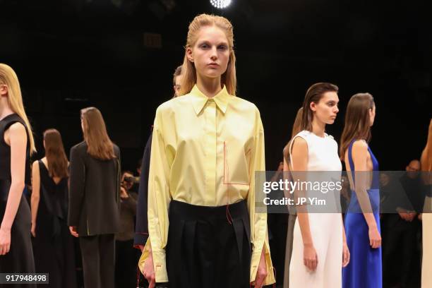 Models pose during BOSS Womenswear Gallery Collection During New York Fashion Week Mens' at Cedar Lake on February 13, 2018 in New York City.