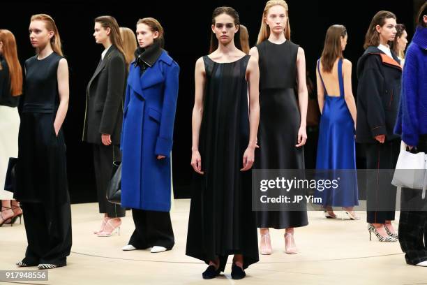 Models pose during BOSS Womenswear Gallery Collection During New York Fashion Week Mens' at Cedar Lake on February 13, 2018 in New York City.