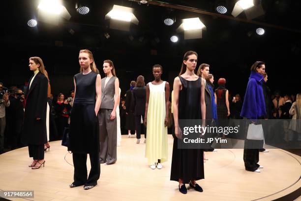 Models pose during BOSS Womenswear Gallery Collection During New York Fashion Week Mens' at Cedar Lake on February 13, 2018 in New York City.