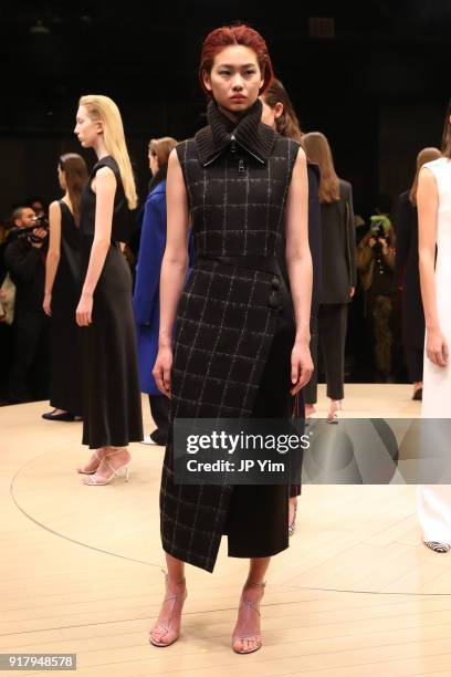 Models pose during BOSS Womenswear Gallery Collection During New York Fashion Week Mens' at Cedar Lake on February 13, 2018 in New York City.