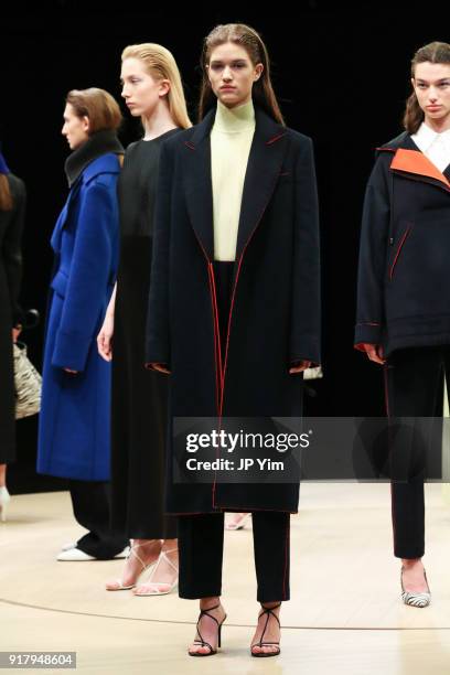 Models pose during BOSS Womenswear Gallery Collection During New York Fashion Week Mens' at Cedar Lake on February 13, 2018 in New York City.