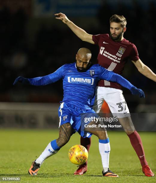 Josh Parker of Gillingham attempts to control the ball under pressure from Jordan Turnbull of Northampton Town in action during the Sky Bet League...