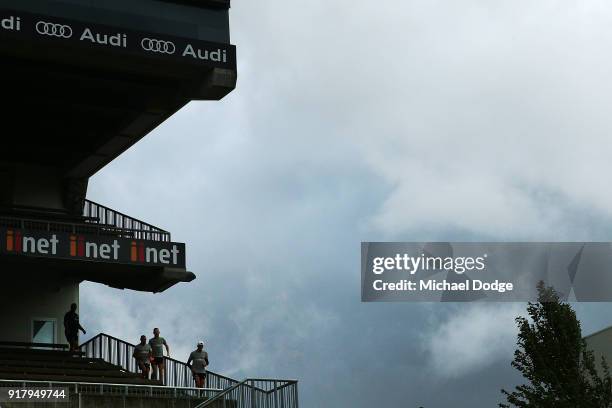 Hawks players walk out as a storm whips through during a Hawthorn Hawks AFL training session on February 14, 2018 in Melbourne, Australia.