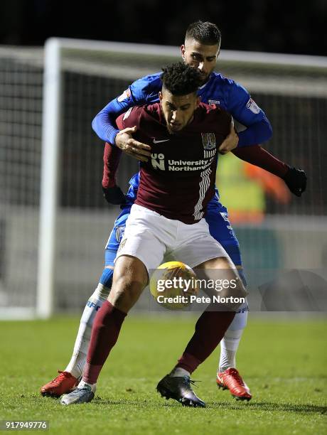 Daniel Powell of Northampton Town looks to control the ball under pressure from Max Ehmer of Gillingham during the Sky Bet League One match between...