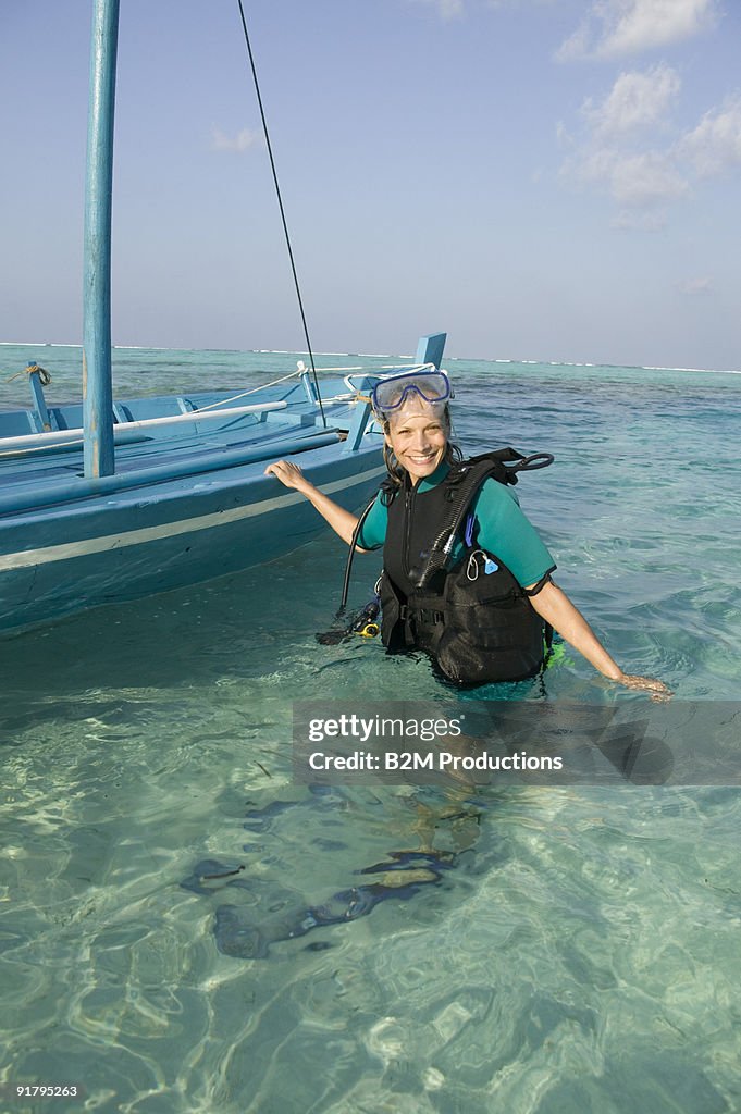 Woman in snorkeling gear in ocean